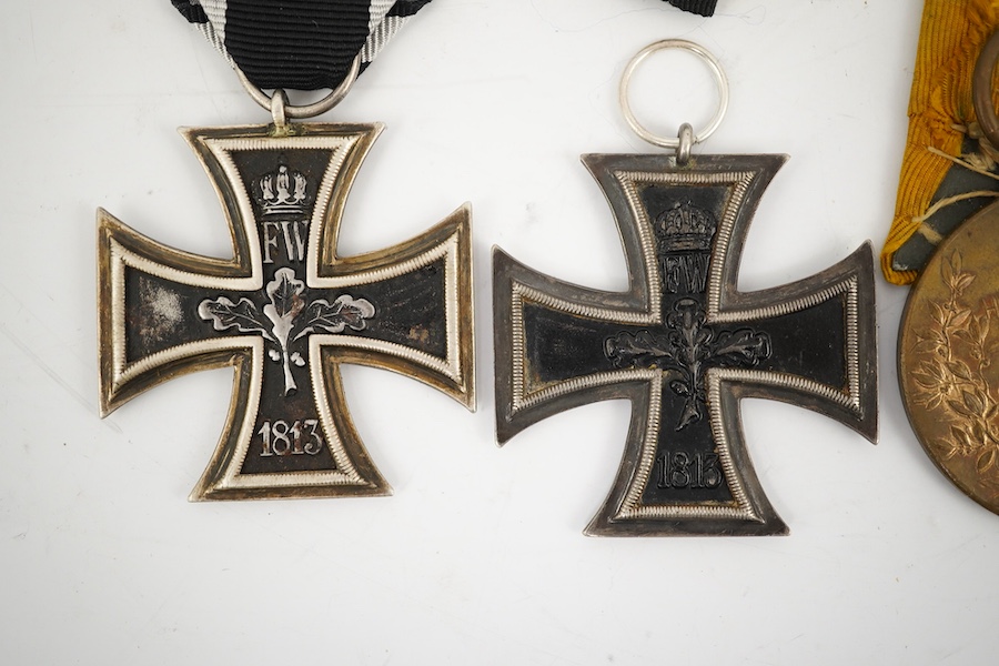 Five German WWI medals; two Second class Iron Crosses, two Kaiser Wilhelm Centenary medals and an Honour Cross 1914-1918. Condition - fair.